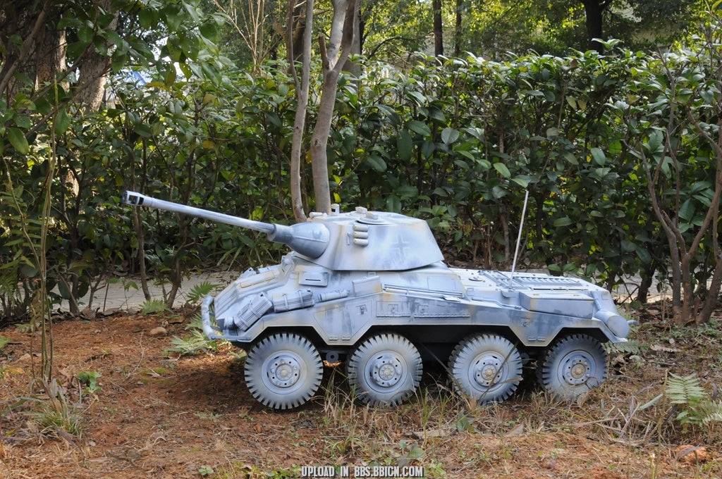 Side view of the EAXTOYS 1/6 scale WWII German Sd.Kfz.234/2 Puma model in a forest setting, highlighting its realistic design.