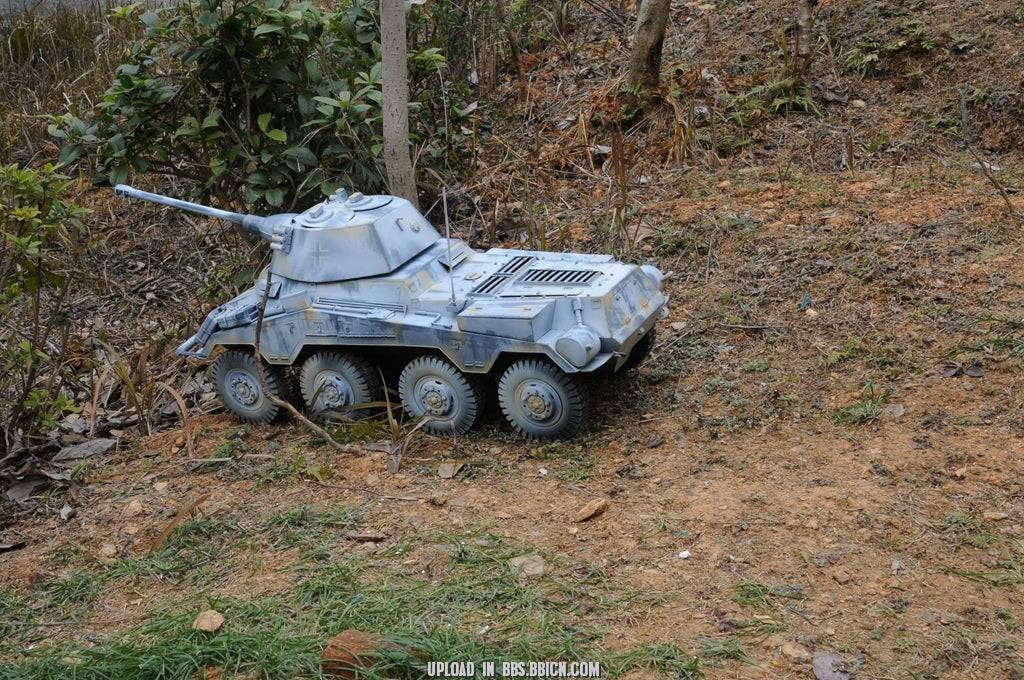 EAXTOYS 1/6 scale WWII German Sd.Kfz.234/2 Puma model positioned on a dirt path, showcasing its detailed weathering effects.